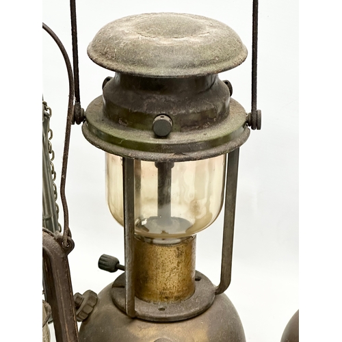 634 - A large Tilley 106 lamp. Together with another Tilley lamp and others.