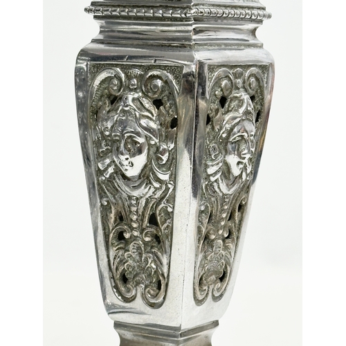 2 - James Cartland & Co. A pair of Late 19th Century polished pierced vases. Makers mark. 23cm.