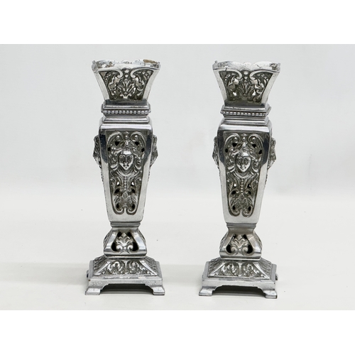 2 - James Cartland & Co. A pair of Late 19th Century polished pierced vases. Makers mark. 23cm.