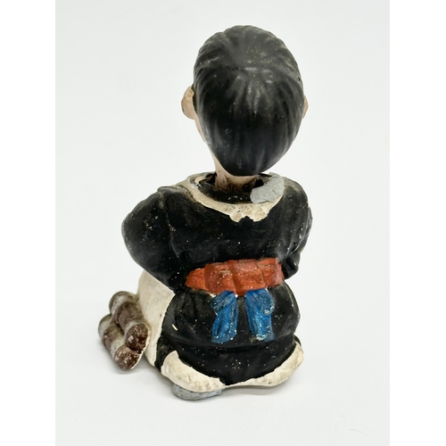 218 - A pair of Early 20th Century Japanese pottery nodder dolls. 8cm.