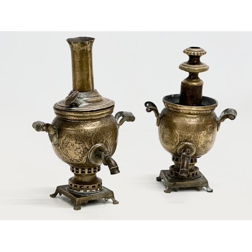 378 - A pair of small 19th Century Islamic style engraved brass samovars. 23cm