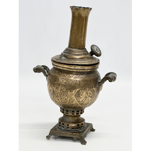 378 - A pair of small 19th Century Islamic style engraved brass samovars. 23cm