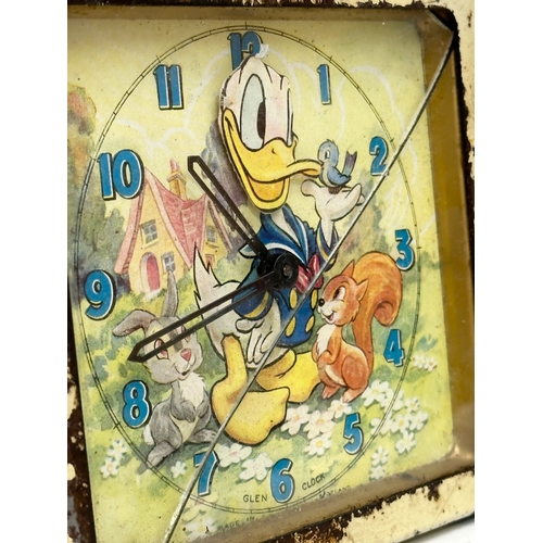 502 - A 1940’s Walt Disney Donald Duck mantle clock. Glen Clock. Made in Scotland. 14x5x13cm.