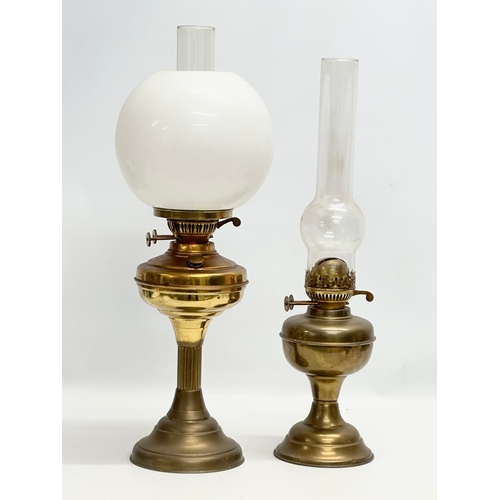 676 - 2 Mid 20th Century brass double burner oil lamps. 58cm