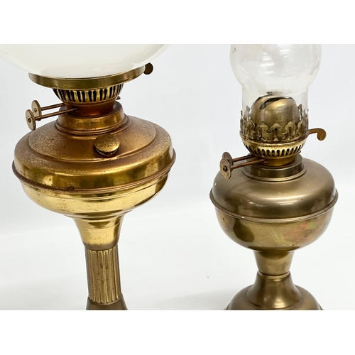 676 - 2 Mid 20th Century brass double burner oil lamps. 58cm