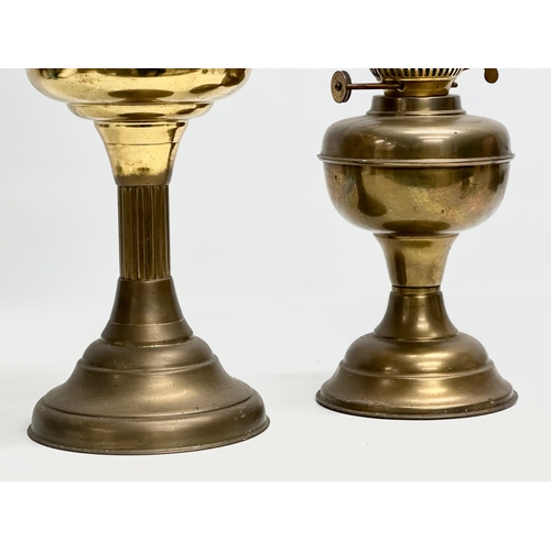 676 - 2 Mid 20th Century brass double burner oil lamps. 58cm