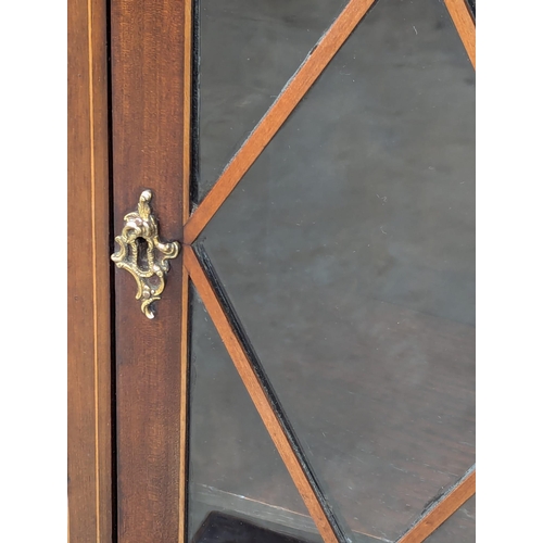 439 - A fine proportioned 19th Century Georgian style inlaid mahogany bookcase with astragal glazed doors,... 