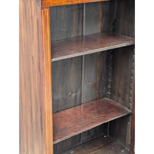 439 - A fine proportioned 19th Century Georgian style inlaid mahogany bookcase with astragal glazed doors,... 