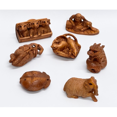 327 - 7 Japanese carved boxwood netsuke figures.