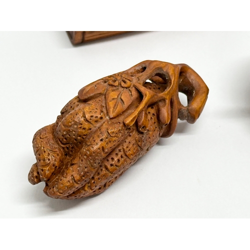 327 - 7 Japanese carved boxwood netsuke figures.