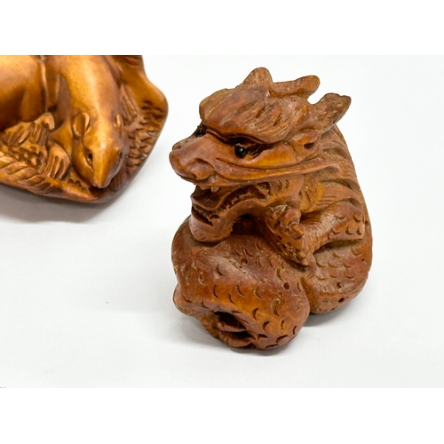 327 - 7 Japanese carved boxwood netsuke figures.