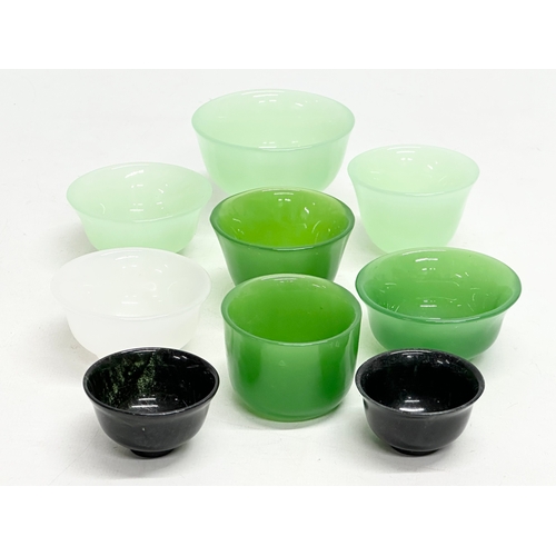 328 - 9 Chinese jade tea bowls.