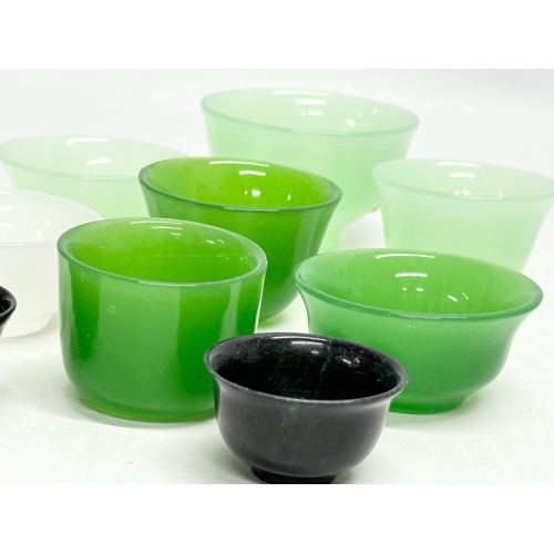 328 - 9 Chinese jade tea bowls.