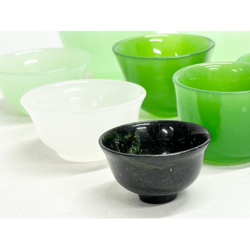 328 - 9 Chinese jade tea bowls.