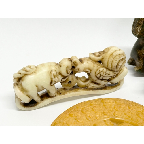 329 - A collection of Chinese carved jade, opal stone and soapstone figures.