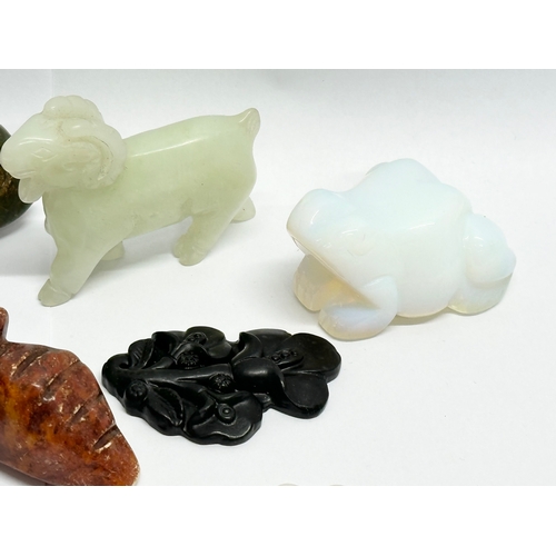 329 - A collection of Chinese carved jade, opal stone and soapstone figures.