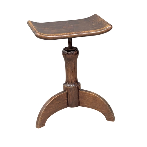 625 - A Late 19th Century / Early 20th Century mahogany revolving stool. 9