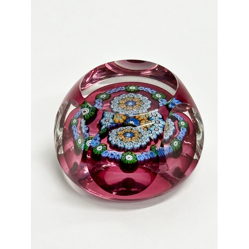 179 - A Perthshire millefiori glass paperweight.