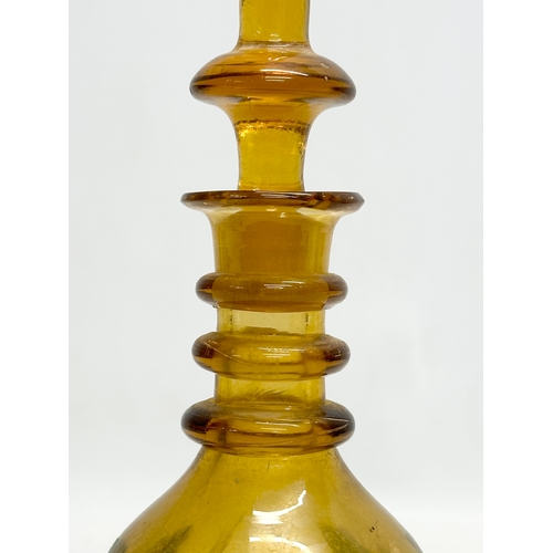 193 - A Late 19th Century hand painted amber glass, 3 ring decanter. Moser style. 27cm