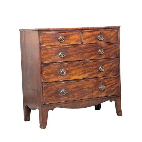 416 - A Late George III inlaid mahogany chest of drawers on sprayed bracket feet. Circa 1800-1810. 107x50x... 