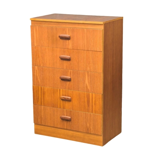 585 - A Mid Century teak chest of drawers. 69x41x106cm(11)