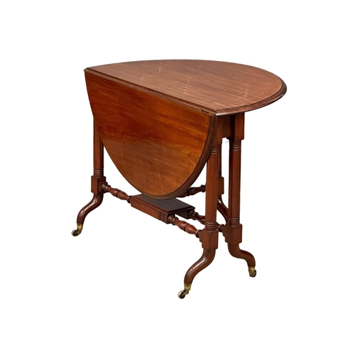 669 - A large Victorian mahogany Sutherland table. Double stretcher support on brass cup casters. 19th Cen... 