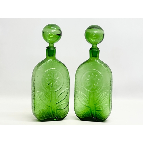 94 - Wayne Husted. A pair of large Stelvia Glass bottles with stoppers. Designed by Wayne Husted for Stel... 