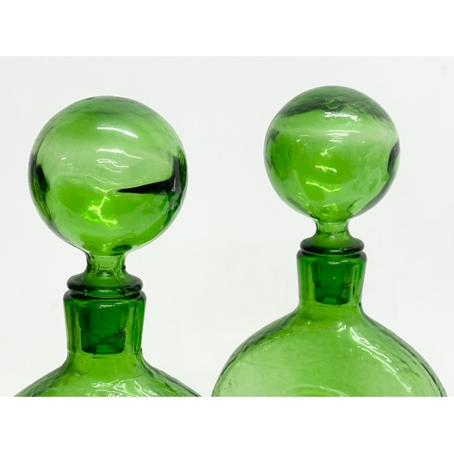 94 - Wayne Husted. A pair of large Stelvia Glass bottles with stoppers. Designed by Wayne Husted for Stel... 