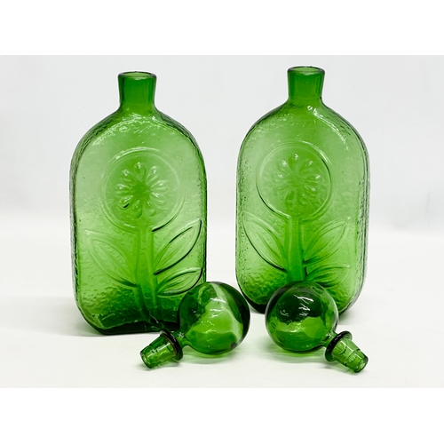 94 - Wayne Husted. A pair of large Stelvia Glass bottles with stoppers. Designed by Wayne Husted for Stel... 