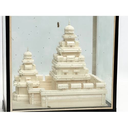 649 - A cased display of The Shore Temple. A little gem of a shrine. 20.5x15.5x21.5cm.