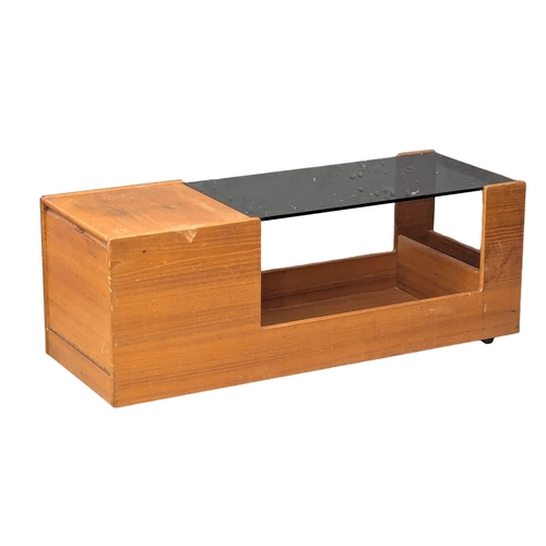 363 - A McIntosh Mid Century teak coffee table with smoked glass top and storage. 121.5x44x43cm (10)