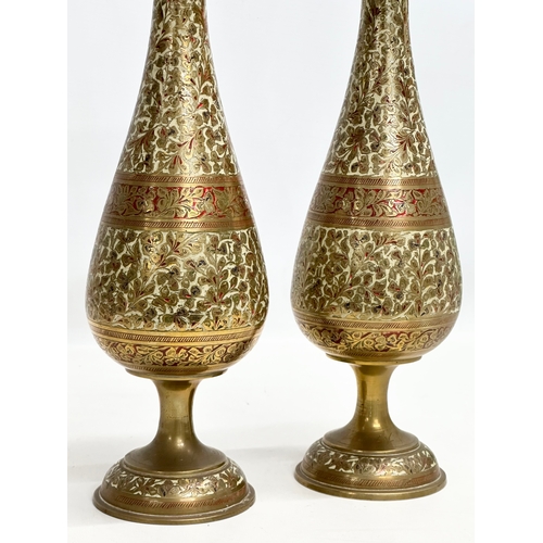 806 - A pair of tall Mid 20th Century Indian engraved brass vases. 36cm