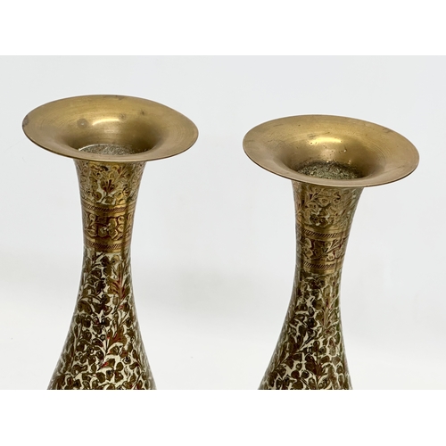 806 - A pair of tall Mid 20th Century Indian engraved brass vases. 36cm