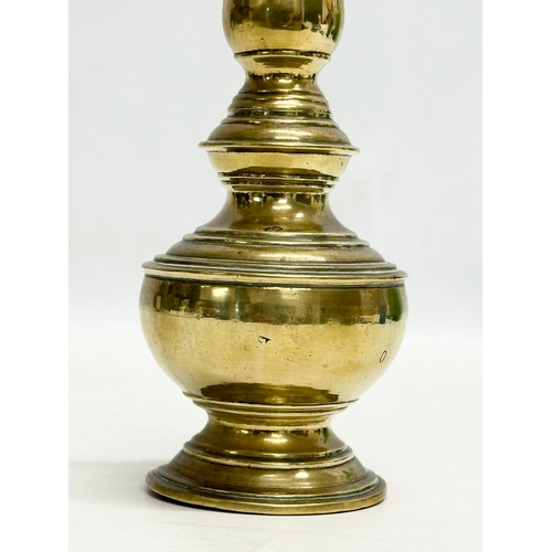 195 - An Early 19th Century Indian brass rose water sprinkler. 28cm.