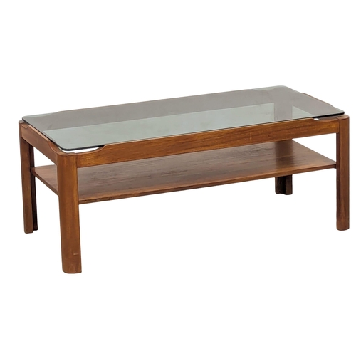 621 - A Mid Century teak coffee table with smoked glass top by Myer. 88x44x35cm(9)