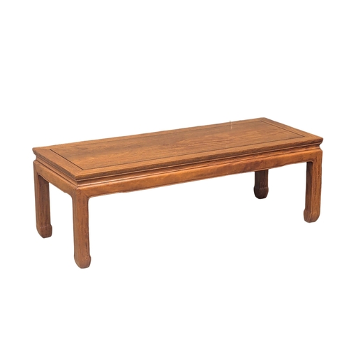 926 - A Chinese teak coffee table. 122x48x41cm(10)