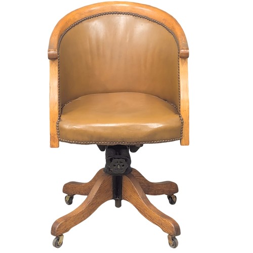 783 - An Early 20th Century oak swivel desk chair with oringal leather seat. Circa 1900.(1)