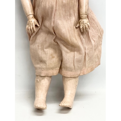 706 - A large Early 20th Century French porcelain doll. By S.F.B.J, Paris. 52cm