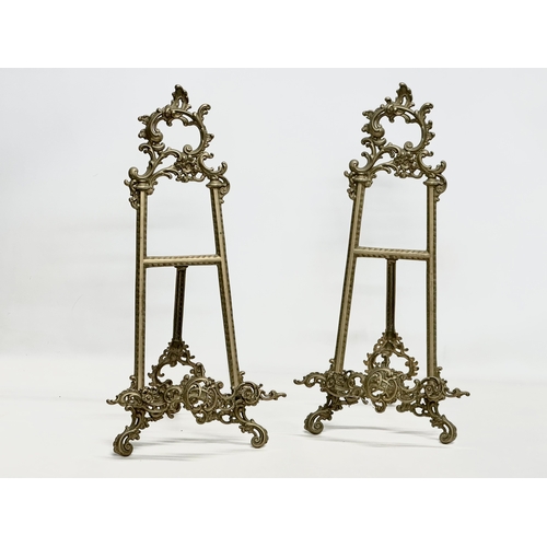 714 - A pair of large rococo style brass table top easels. 27x26x54cm