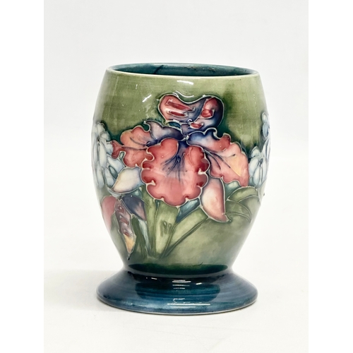 344 - A William Moorcroft “Orchard & Spring Flowers” vase. 8x11cm.