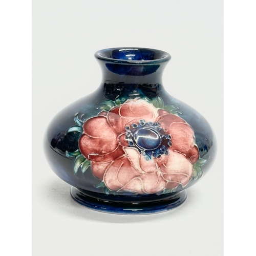 345 - A small William Moorcroft “Anemone” vase. 8x7cm.