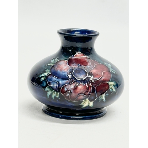 345 - A small William Moorcroft “Anemone” vase. 8x7cm.