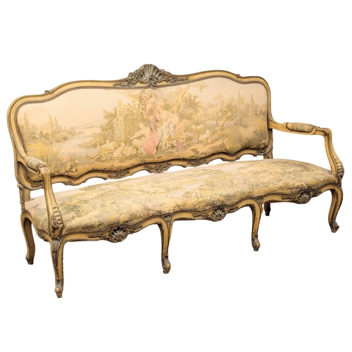 268 - A large 19th Century Louis XV style sofa with needlepoint work and original French cream painted fin... 