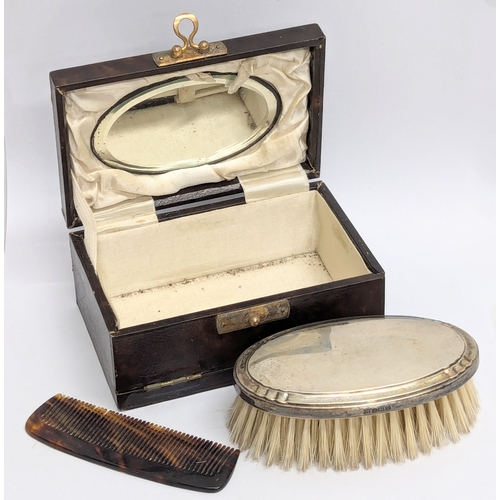 735 - An Early 20th Century vanity case with silver back brush. Birmingham 1902.