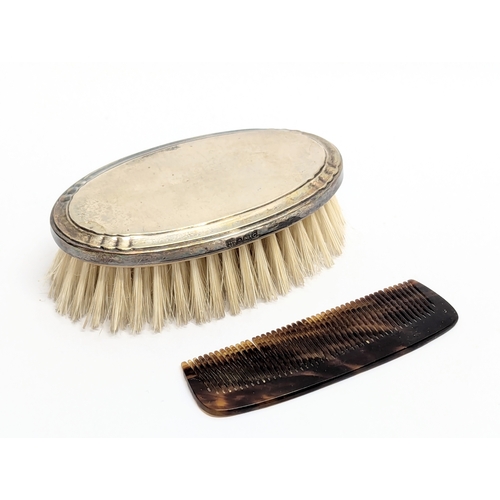 735 - An Early 20th Century vanity case with silver back brush. Birmingham 1902.