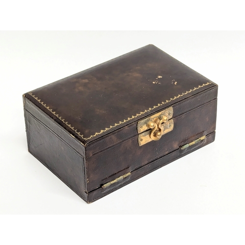 735 - An Early 20th Century vanity case with silver back brush. Birmingham 1902.