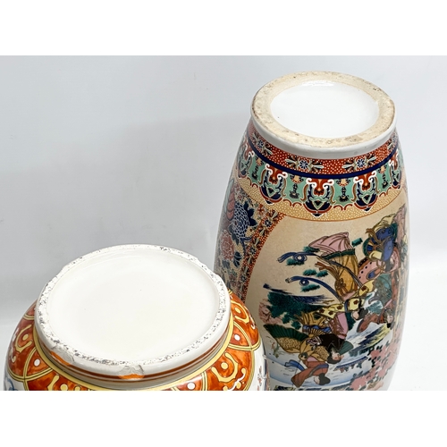 818 - Two large Chinese pottery vases. 45cm. 39cm.