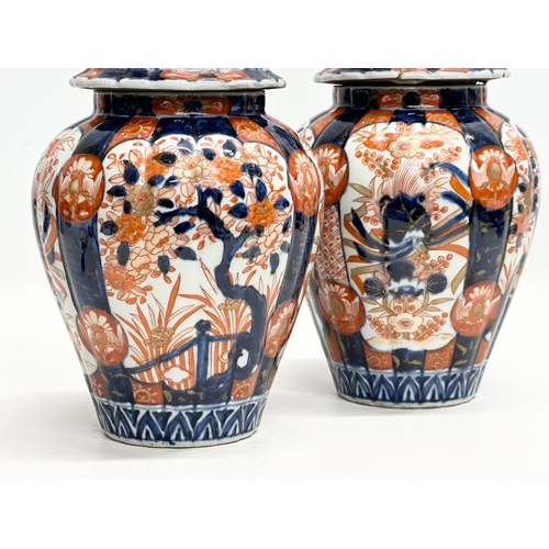 816 - A pair of Late 19th Century Japanese Imari jars with covers. Meiji Period (1868-1912) 15x33cm.