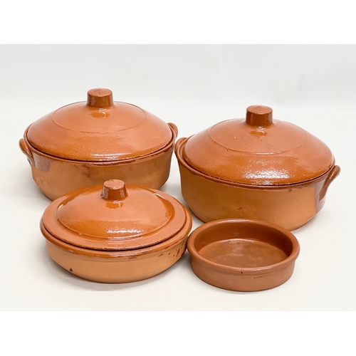 832 - 4 Spanish glazed terracotta casserole dishes. 21x19x15cm.