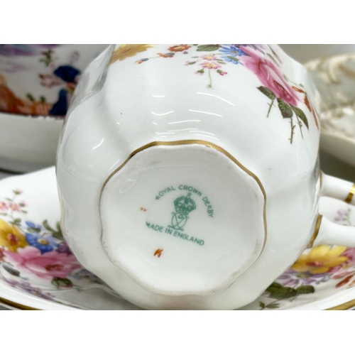 823 - A collection of 19th and 20th Century tea ware. Royal Crown Derby, Davenport, Aynsley, Dresden, Mint... 